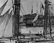 Sailing vessels awaiting lockage in old Welland Ship Canal ca 1890 - 1900