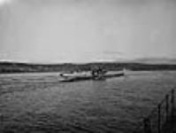 German submarine U-190 after surrendering to units of the R.C.N.. Ship in background is H.M.C.S. ML095 14 mai 1945
