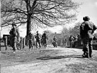 Infantrymen of The North Nova Scotia Highlanders advancing towards Bathmen. Dorterhoek, Netherlands, 8 April 1945 April 8, 1945.