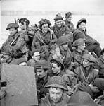 Infantrymen of the Stormont, Dundas and Glengarry Highlanders aboard a Buffalo amphibious vehicle near Mehr, Germany, 11 February 1945 February 11, 1945.