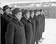 Personnel of the Women's Royal Canadian Naval Service (W.R.C.N.S.) drilling on the parade square during initial training at H.M.C.S. CONESTOGA, Galt, Ontario, Canada, December 1943 December 1943.