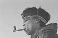 [John Ollie wearing wooden sunglasses.] 1949-1950