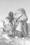 Two Inuit women in amautiit, Inukjuak (formerly Port Harrison), Quebec 1947-1948.