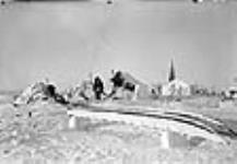 Camp scene (inverted sled in foreground) 1949 - 1950
