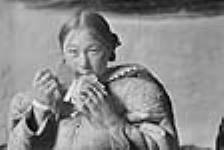 Unidentified Inuit woman with ulu 1950