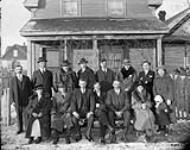 Hungarian immigrants: officers and members of King St.Stephen Roman Catholic Hungarian Sick Benefit Society in front of their office 1925