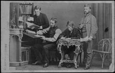 Occupational studio portrait of four gentlemen, two writing and the other two holding documents ca. 1860's