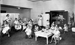 Children and nurses at the Ottawa Day Nursery ca. 1930