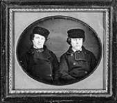 Two unidentified men wearing fur hats ca. 1855