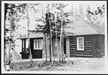 Presentation to Rt. Hon. W.L. Mackenzie King of a log cabin from his constituents at the official opening of Prince Albert National Park 10 Aug. 1928