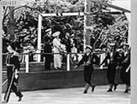 King George VI and Queen Elizabeth on reviewing stand during marchpast of personnel of the Royal Canadian Navy 30 May 1939