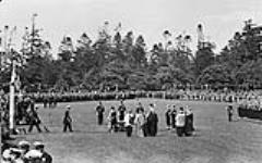 King George VI presenting the King's Colour to the Royal Canadian Navy during a ceremony in Beacon Hill Park 30 May 1939.