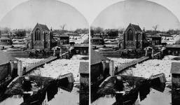 Ice jam, which caused a flood, beneath a foot bridge from the east side of the river avril 1885