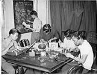 A group of Chinese Canadian students working on radio sets c 1960