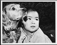 Chinese year of the dog, (Chinese lunar calendar year 4656), begins with Susan Chow wishing Toby a happy new year c.a. 1960