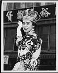 Most popular of girls in Chinese Public School beauty contest is Lynn Lam, 17. She will compete with girl sponsored by Chinese Community School for right to be Chinatown's Centennial Queen. Lynn rode in Chinese Centennial parade Sunday c.a. 1960