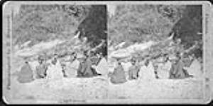 "Le Tete Indians" group of 6 women seated, canoe in background ca. 1870's