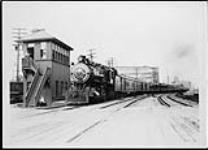 C.P.R. (Canadian Pacific Railway) Train No.4, the "Toronto Express", drawn by Locomotive No.3876, leaving Heatley Avenue Station ca.1920-1930