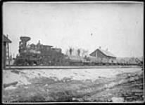 Locomotive No.203 of the Canadian Pacific Railway with a load of square timber en route to Papineauville, Quebec 1884