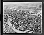 Welland Canal. Aerial view showing twin locks 6, 5 and 4 in background with town in foreground c.a. 1930