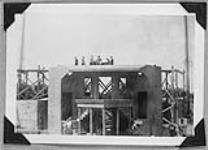 The rising of the tent at Stratford Shakespearean Festival Foundation of Canada - men working over the stage 27-28 June 1953