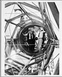 Dr. Andrew McKellar in telescope (left) ca. 1930