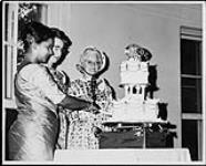 Cutting birthday cake: Mrs. Arste, Matheson and Stoney. Taken during the National Convention of the Federated Women's Institutes of Canada 1967