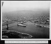 Aerial view of the harbour showing S.S. Duchess of Richmond appraoching Jacques Cartier bridge. Taken from H.M. Airship R-100 Aug. 1930