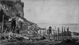 Montagnais making bark canoe vers 1863