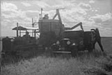 Combine harvester, farmhouse, Manitoba [graphic material] 1933
