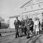 Visit of the President of United States John F. Kennedy and his wife Jacqueline. Group in front of the Government House: President John F. Kennedy, Governor General Georges Vanier, Prime Minister John G. Diefenbaker, Mrs. Kennedy, and Mrs. Diefenbaker May, 1961.