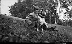 Unidentified young boy with dog ca. 1907