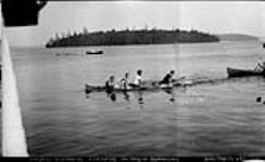 "Four in Canoe Hand Paddling Race", Clevelands, Muskoka Lakes ca. 1910