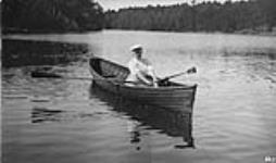 Unidentified woman in rowboat, Craigie Lea, Muskoka Lakes ca. 1907