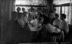 In the summer dining room at Shottery, Muskoka Lakes ca. 1908