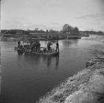 Personnel of the Argyll and Sutherland Highlanders of Canada operating an improvised ferry across the Dortmund-Ems Canal 8 Apr. 1945