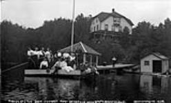 Fishing off the dock at Shottery, Lake Joseph, Muskoka Lakes ca. 1908