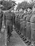 Lieutenant-General G.G. Simonds, General Officer Commanding 2nd Canadian Corps, inspecting personnel of the Royal Canadian Artillery (R.C.A.), Meppen, Germany, 31 May 1945 May 31, 1945.