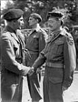 Second Canadian Corps - General Simonds talking to Major A.L. Gordon ant to Captain J.S. Glover 31 May 1945