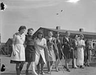Polish Army Girls Prisoner of War Camp. Hospital patients are taken for a walk. Many of the women are still suffering from battle wounds 7 May 1945