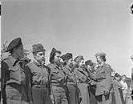Polish Army Girls - P.O.W. Camp - Commandant oasses down the lines on morning inspection 7 May 1945
