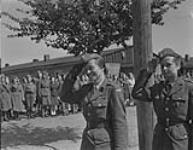 Polish Army Girls - Prisoner of War Camp - Commandant and aid taking the salute from company commanders 7 May 1945