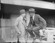 Lord Shaughnessy (Thomas George), standing and J.K.L. Ross on fence ca. 1915-1920