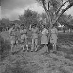 Lieutenant-General E.L.M. Burns (fourth from left) and other senior officers during Lieutenant-General Kenneth Stuart's visit to units of the 1st Canadian Corps July 1944