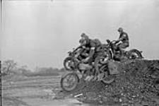 Dispatch riders of the 4th Canadian Armoured Division on motorcycles 11 Jan.. 1943