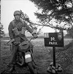 Despatch rider Cecil Whidden of 25th Canadian Infantry Signals Squadron on exercise 25 Jan. 1951