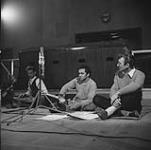 L-R:Unidentified musician, sitar player Ravi Shanker, film creator Norman McLaren of the National Film Board during the making of A Chairy Tale Mar. 1957