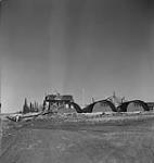 Quonset huts and platform for Bofors 40mm. anti-aircraft gun of the Royal Canadian Artillery May 1943