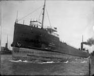 Close port bow view of laker, J.L. WEEKS, of the Gilchrist Transportation Co., in entry to locks 1912
