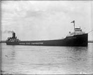 Starboard view of laker ERNEST T. WEIR, laden, of the National Steel Corporation, in river 1936